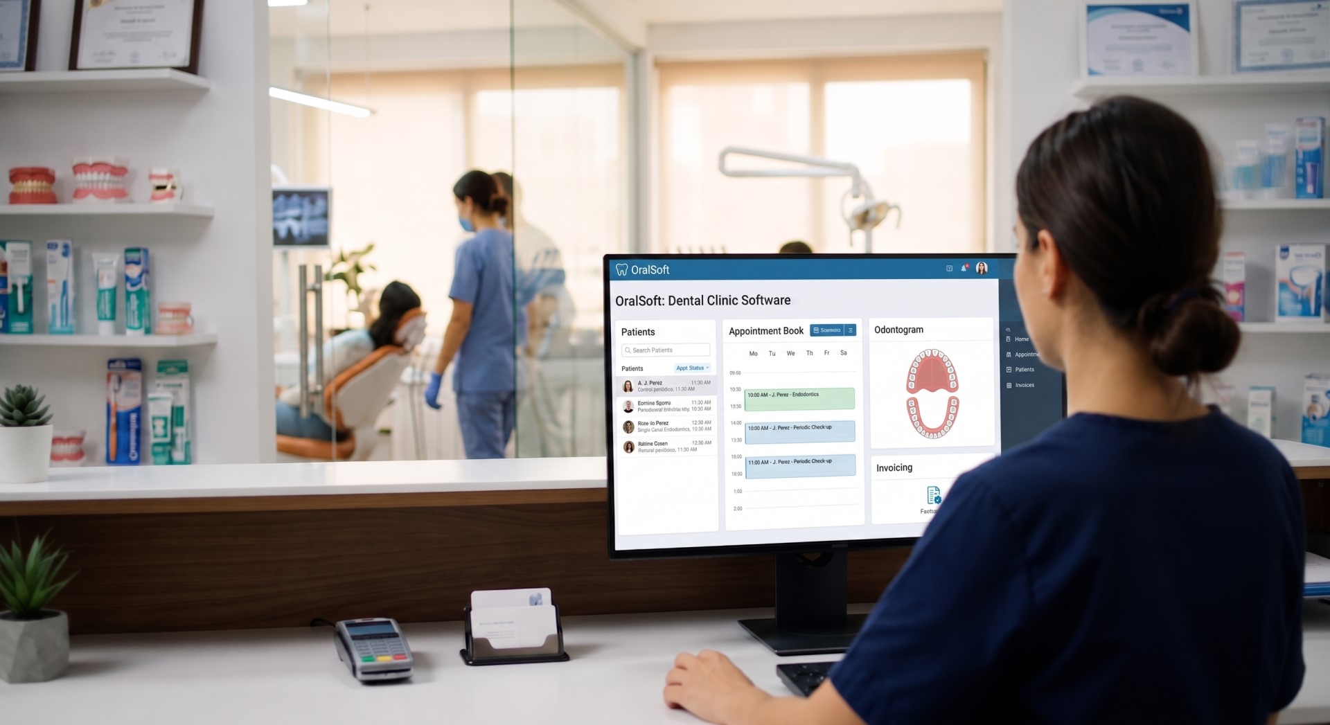 The front desk of a dental clinic with OralSoft dental software open on the counter screen.